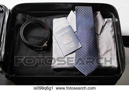 Clothes folded in a suitcase View Large Photo Image Stock Image - Clothes folded in a suitcase. Fotosearch