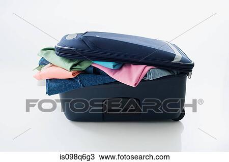 Clothes stuffed in a suitcase View Large Photo Image Stock Image - Clothes stuffed in a suitcase. Fotosearch