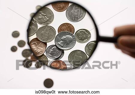 Coins and magnifying glass View Large Photo Image Stock Photograph - Coins and magnifying glass. Fotosearch