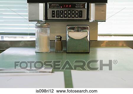 Stock Image - Condiments on a diner counter. Fotosearch