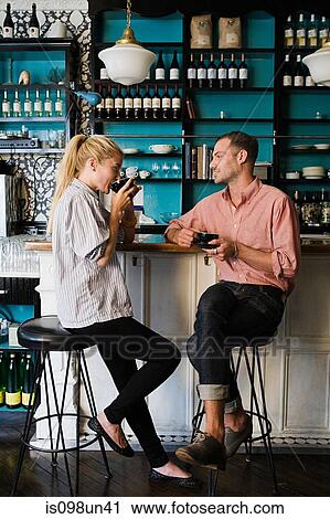 Couple at coffee bar View Large Photo Image Stock Image - Couple at coffee bar. Fotosearch