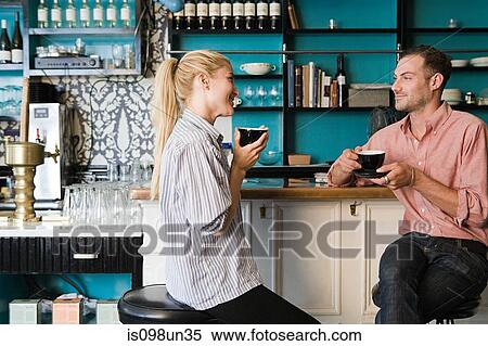 Couple at coffee bar View Large Photo Image Stock Photography - Couple at coffee bar. Fotosearch