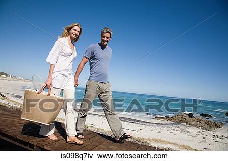 Stock Photo - Couple at the coast. Fotosearch