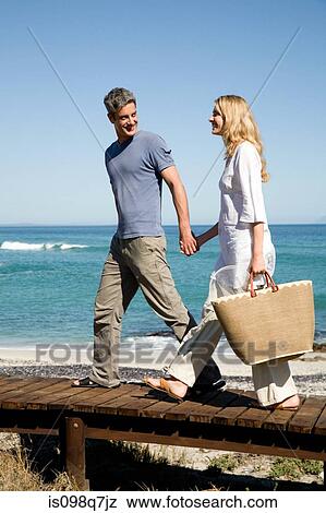 Stock Photo - Couple at the coast. Fotosearch