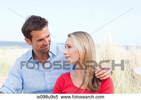 Couple at the coast View Large Photo Image Stock Photography - Couple at the coast. Fotosearch