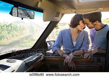 Couple by automobile View Large Photo Image Stock Photograph - Couple by automobile. Fotosearch