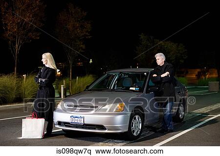 Couple by car View Large Photo Image Stock Photography - Couple by car. Fotosearch