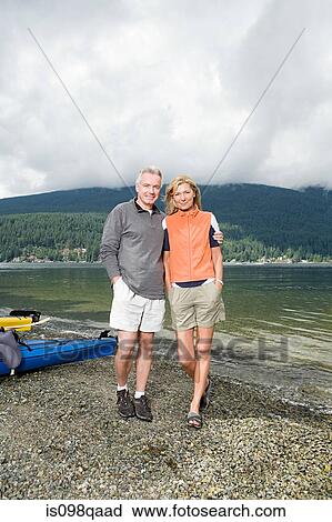 Stock Image - Couple by fjord. Fotosearch