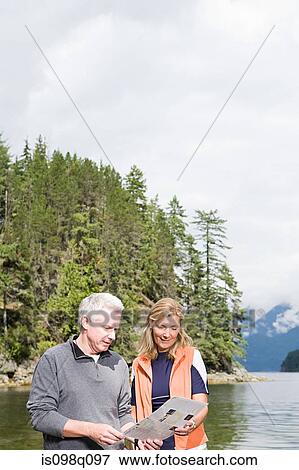 Stock Photo - Couple by lake. Fotosearch