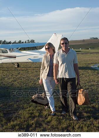 Couple by private aeroplane View Large Photo Image Stock Image - Couple by private aeroplane. Fotosearch
