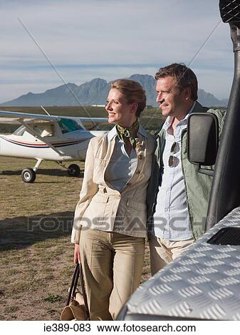 Couple by private aeroplane View Large Photo Image Stock Image - Couple by private aeroplane. Fotosearch