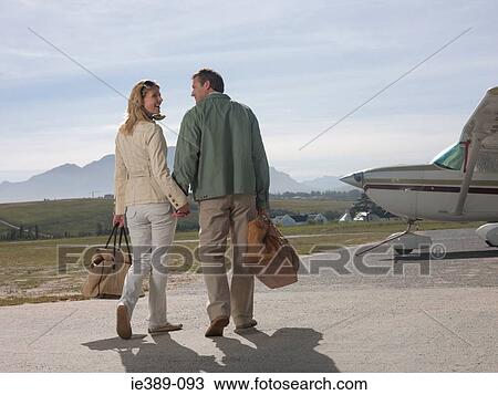 Stock Image - Couple by private aeroplane. Fotosearch
