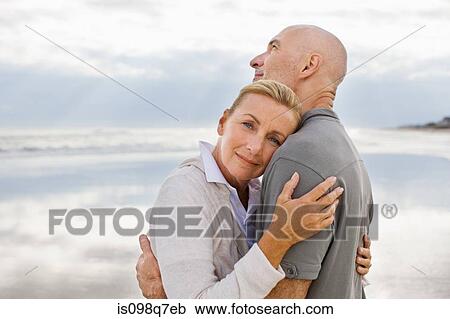 Stock Image - Couple by the sea. Fotosearch