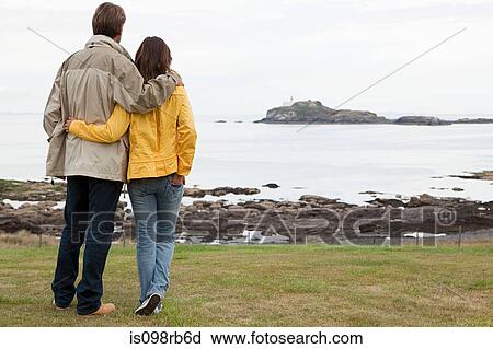 Couple by the sea View Large Photo Image Stock Image - Couple by the sea. Fotosearch