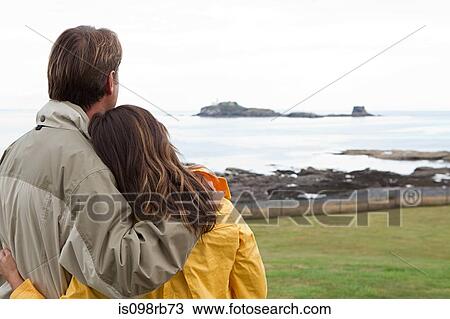 Couple by the sea View Large Photo Image Stock Image - Couple by the sea. Fotosearch