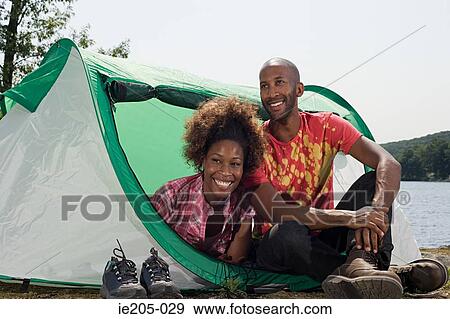 Couple camping View Large Photo Image Stock Photo - Couple camping. Fotosearch