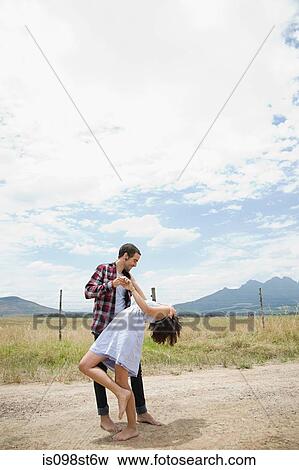 Couple dancing in remote setting View Large Photo Image Stock Photo - Couple dancing in remote setting. Fotosearch