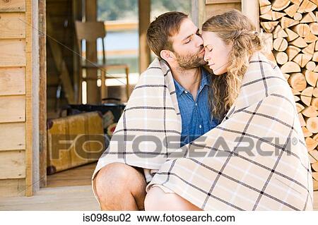 Stock Image - Couple enjoying lakeside vacation. Fotosearch