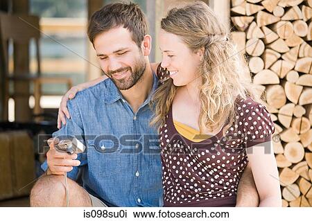 Stock Image - Couple enjoying lakeside vacation. Fotosearch