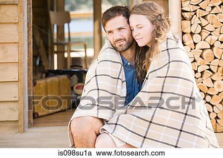 Couple enjoying lakeside vacation View Large Photo Image Stock Image - Couple enjoying lakeside vacation. Fotosearch