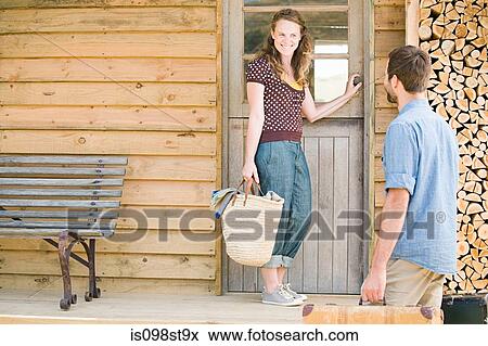 Couple enjoying lakeside vacation View Large Photo Image Stock Photo - Couple enjoying lakeside vacation. Fotosearch