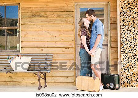 Couple enjoying lakeside vacation View Large Photo Image Stock Photo - Couple enjoying lakeside vacation. Fotosearch