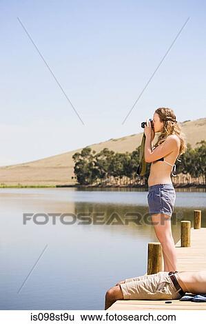 Stock Photograph - Couple enjoying lakeside vacation. Fotosearch