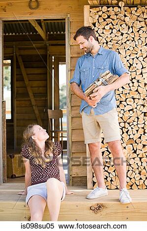 Couple enjoying lakeside vacation View Large Photo Image Stock Photography - Couple enjoying lakeside vacation. Fotosearch