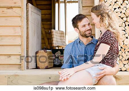 Stock Photography - Couple enjoying lakeside vacation. Fotosearch