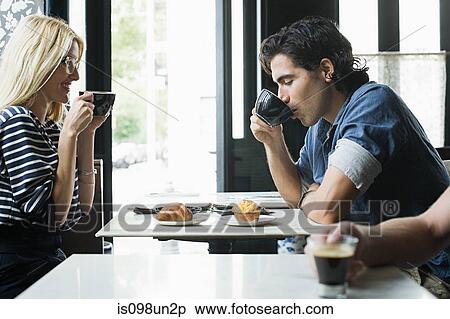 Stock Photography - Couple having coffee in cafe. Fotosearch