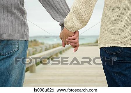 Couple holding hands View Large Photo Image Stock Photography - Couple holding hands. Fotosearch