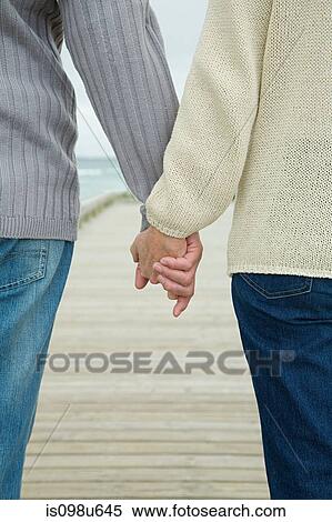 Couple holding hands View Large Photo Image Stock Photography - Couple holding hands. Fotosearch