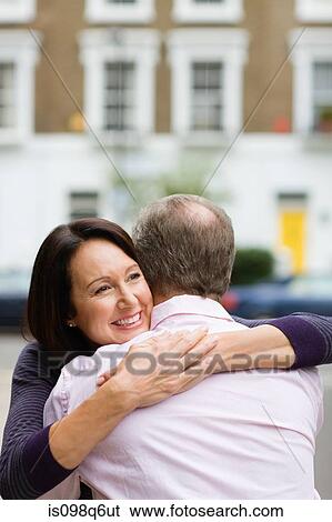 Stock Photograph - Couple hugging. Fotosearch