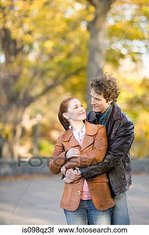 Stock Image - Couple in a park. Fotosearch
