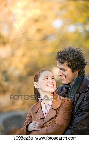 Couple in a park View Large Photo Image Stock Image - Couple in a park. Fotosearch