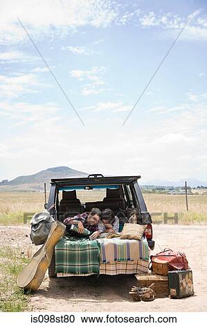 Couple in back of suv View Large Photo Image Stock Image - Couple in back of suv. Fotosearch