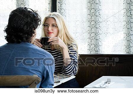 Stock Photo - Couple in coffee shop. Fotosearch
