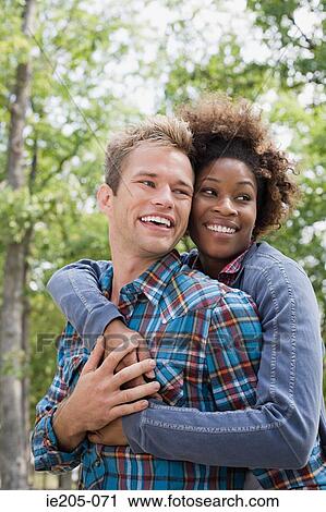 Stock Image - Couple in forest. Fotosearch