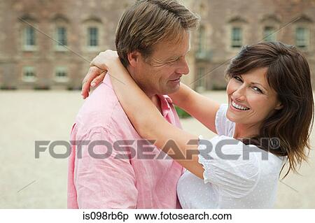 Couple in front of hotel View Large Photo Image Stock Photography - Couple in front of hotel. Fotosearch