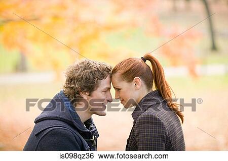 Stock Photograph - Couple in park. Fotosearch