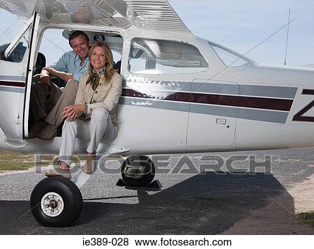Couple in private aeroplane View Large Photo Image Stock Photo - Couple in private aeroplane. Fotosearch