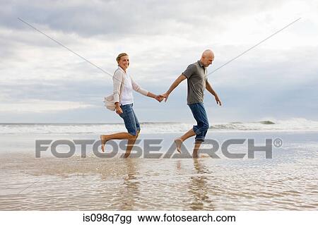Stock Image - Couple in the sea. Fotosearch