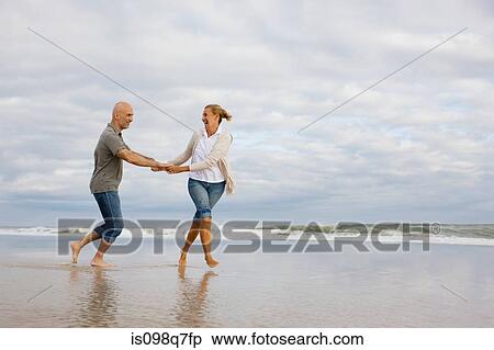 Stock Photography - Couple in the sea. Fotosearch