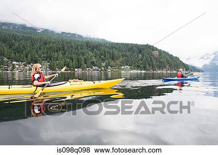 Couple kayaking View Large Photo Image Stock Photo - Couple kayaking. Fotosearch
