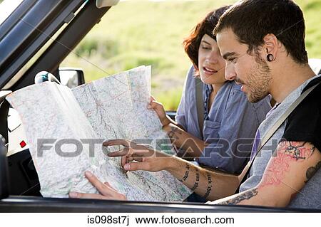 Couple looking at map View Large Photo Image Stock Image - Couple looking at map. Fotosearch