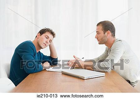 Stock Image - Couple looking serious. Fotosearch