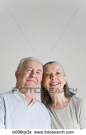 Couple looking up View Large Photo Image Stock Photo - Couple looking up. Fotosearch