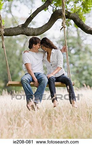 Couple on a swing View Large Photo Image Stock Image - Couple on a swing. Fotosearch