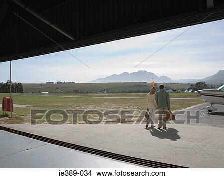 Picture - Couple on airfield. Fotosearch
