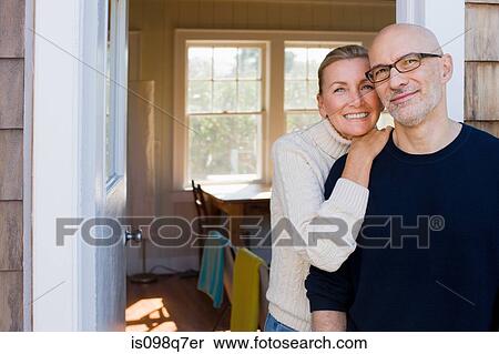 Stock Photography - Couple outside house. Fotosearch